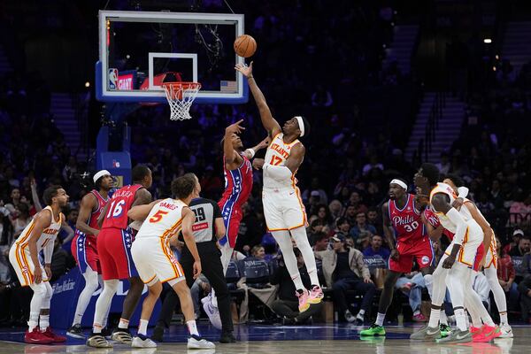 Atlanta Hawks' Onyeka Okongwu 917) and Philadelphia 76ers' Marcus Bagley go up for a jump ball during the second half of an NBA basketball game Friday, April 11, 2025, in Philadelphia. (AP Photo/Matt Rourke)