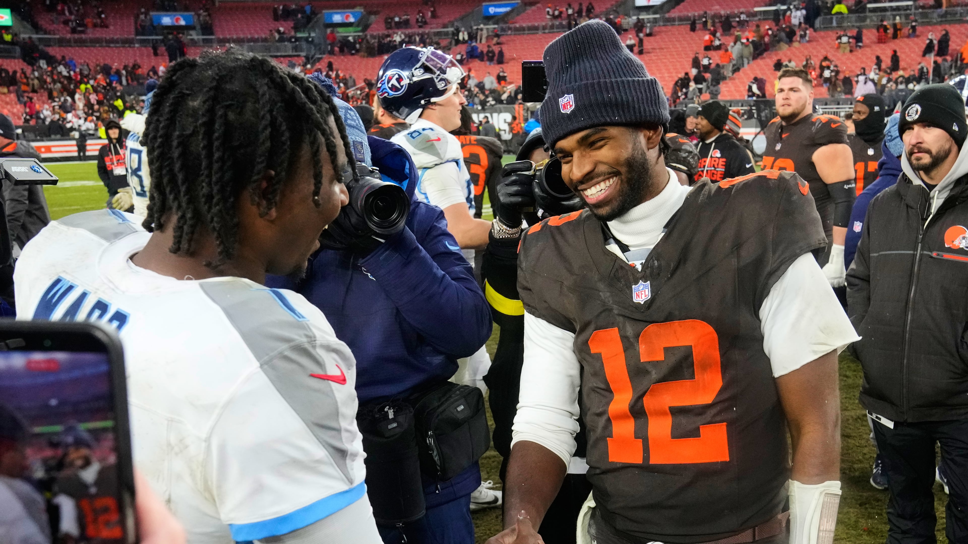 Tennessee Titans quarterback Cam Ward, left, and Cleveland Browns quarterback Shedeur Sanders (12) greet each other after an NFL football game in Cleveland, Sunday, Dec. 7, 2025. (AP Photo/Sue Ogrocki)