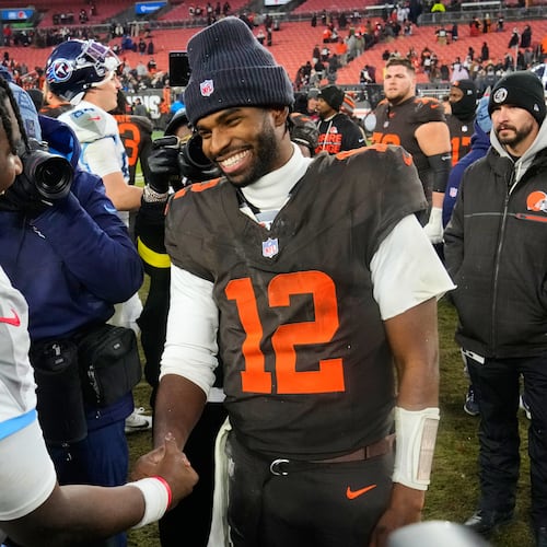 Tennessee Titans quarterback Cam Ward, left, and Cleveland Browns quarterback Shedeur Sanders (12) greet each other after an NFL football game in Cleveland, Sunday, Dec. 7, 2025. (AP Photo/Sue Ogrocki)