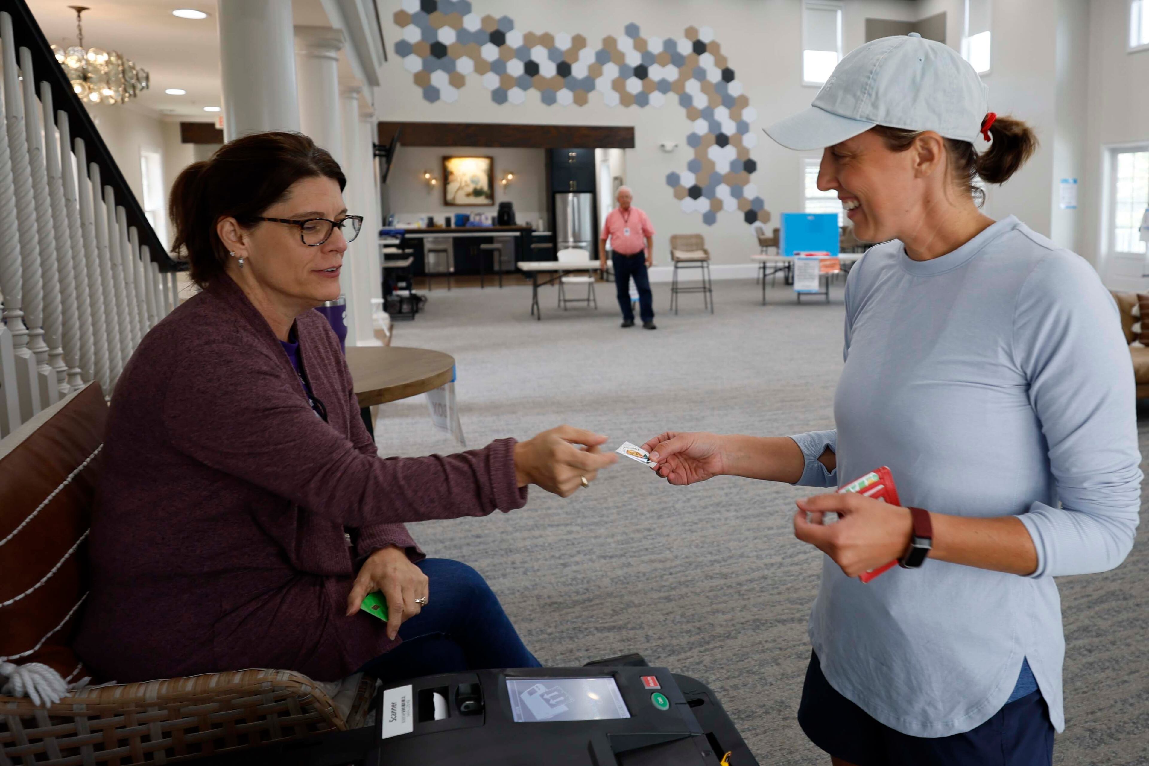 Ashle Lee, 48, of Canton, received her sticker after voting at the River-Green subdivision in Canton during the special election for the Cherokee state senate seat on Tuesday, August 26, 2025. The election aims to fill the remaining term of former state Sen. Brandon Beach, which extends through January 2027.
(Miguel Martinez/ AJC)
