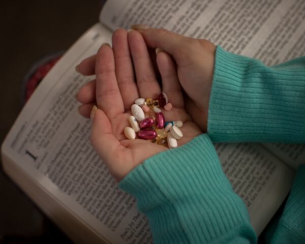 BLACKSHEAR, GA - MARCH 25, 2021: Daily medication and Bible verses help Lisa Martin recover from COVID-19. The former schoolteacher hung on for weeks in an induced coma, even surviving a stroke. (AJC Photo/Stephen B. Morton)