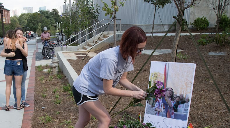 Mourner set out flowers at a memorial for Georgia Tech student Scout Schultz Sunday, September 17, 2017, In Atlanta GA.