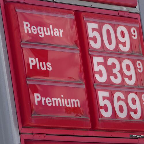 The per-gallon prices for the various grades of gasoline available at a gas station are displayed on a sign above the pumps, Sunday, May 24, 2026, in southeast Denver. (AP Photo/David Zalubowski)