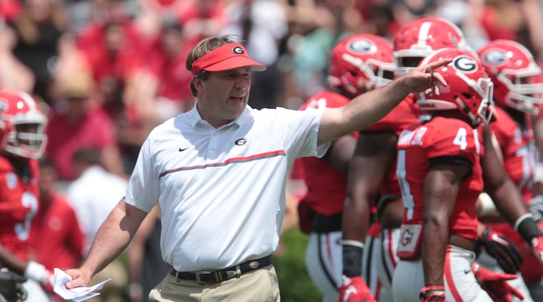 Georgia coach Kirby Smart calls plays from the field during the NCAA college football team's G Day at Sanford Stadium in Athens, Ga., Saturday, April 22, 2017. (John Roark/Athens Banner-Herald via AP)