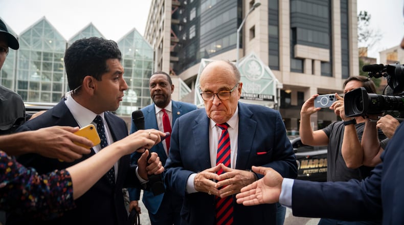 Rudy Giuliani on his way to appear before a grand jury at the Fulton County Courthouse last August. He is one of 19 defendants in a criminal case involving former President Donald Trump's campaign to overturn the 2020 election in Georgia. (Nicole Craine/The New York Times)
