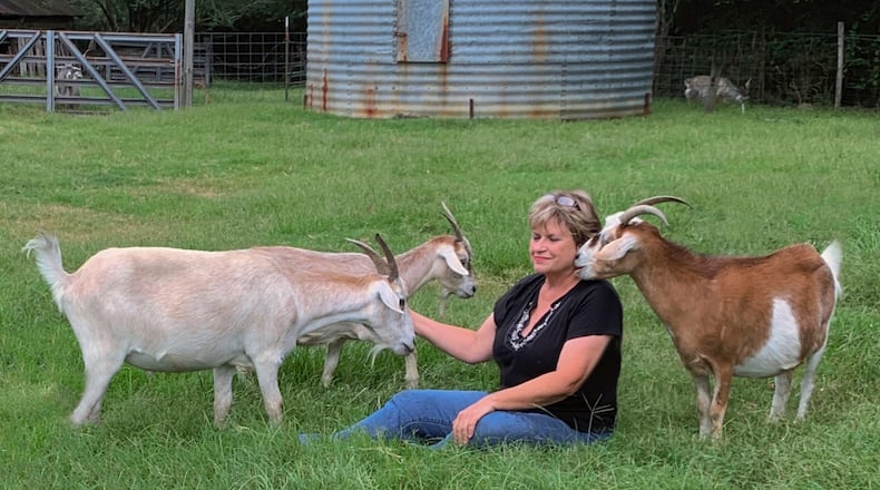 When EG Kight is not touring and recording, she is relaxing with her herd of 11 goats at her Dublin farm. Seen here are Honey Boy, Sweet Pea, and Cotton Top.
(Courtesy of Miriam Kight)