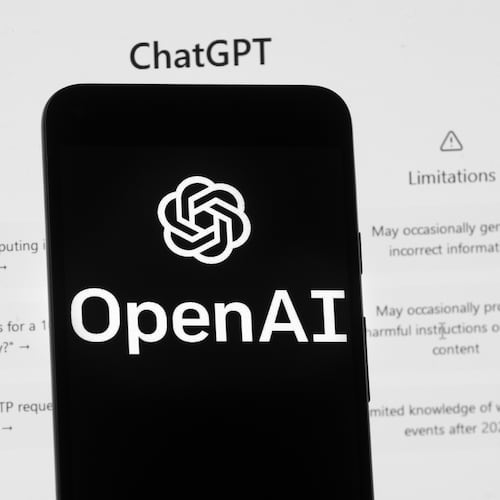 FILE - The OpenAI logo is seen on a mobile phone in front of a computer screen which displays the ChatGPT home Screen, March 17, 2023, in Boston. (AP Photo/Michael Dwyer, File)