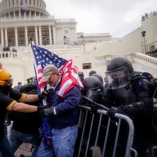 FILE - Rioters try to break through a police barrier at the Capitol on Jan. 6, 2021, in Washington. (AP Photo/John Minchillo, File)
