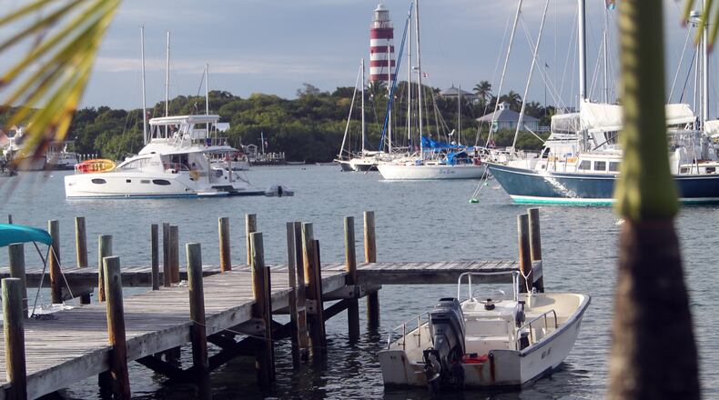 Elbow Reef Lighthouse rises over Hope Town on Elbow Cay. The hand-cranked, kerosene powered lighthouse is more than 150 years old. Photo by Scott Elder for The Washington Post.