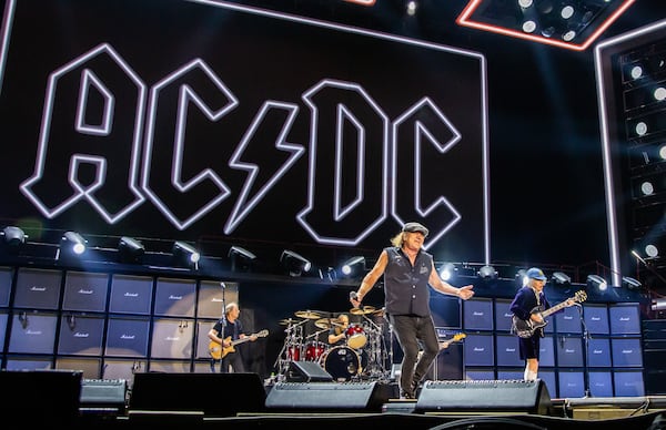 AC/DC played a blistering set of classic rock anthems Thursday night for screaming fans.  (Ryan Fleisher for the AJC)