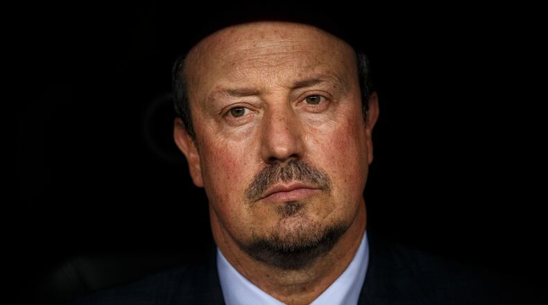 FILE -Real Madrid's head coach Rafa Benitez sits on the bench moments before the Santiago Bernabeu trophy soccer match between Real Madrid and Galatasaray at the Santiago Bernabeu stadium, in Madrid, Aug. 18, 2015. (AP Photo/Daniel Ochoa de Olza, File)