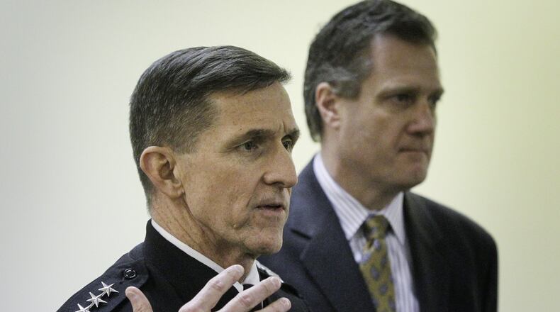 Lt. Gen. Michael T. Flynn, director of the Defense Intelligence Agency, and Congressman Mike Turner speak following a Monday tour of the National Air and Space Intelligence Center at Wright-Patterson Air Force Base. CHRIS STEWART / STAFF