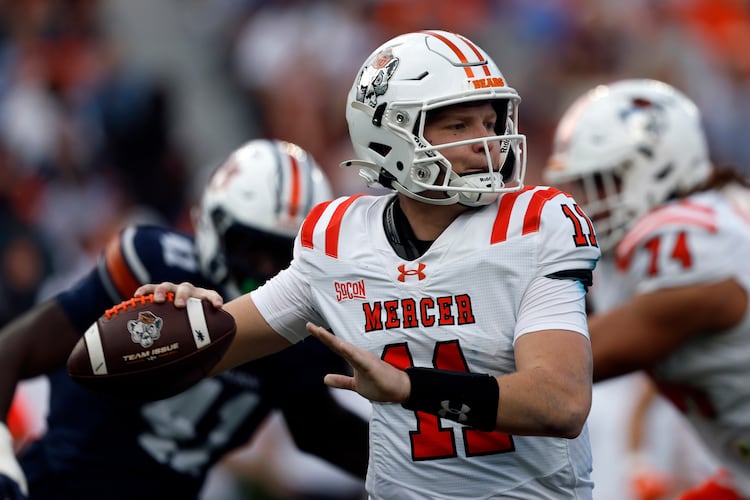 Mercer quarterback Braden Atkinson throws a pass during the first half of an NCAA college football game against Auburn, Saturday, Nov. 22, 2025, in Auburn, Ala. (Butch Dill/AP)