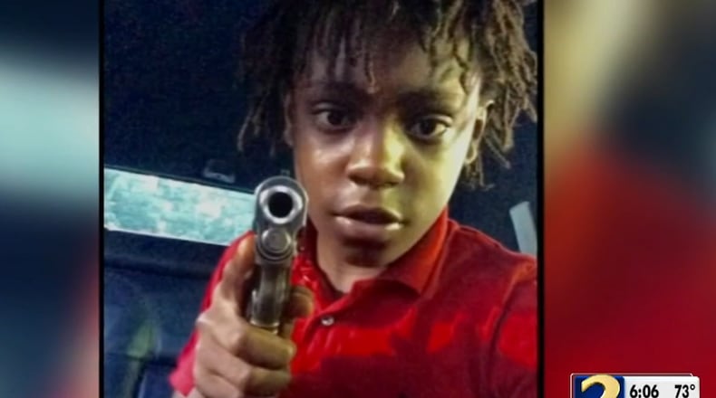 A Facebook photo of 14-year-old Reginald Lofton holding a gun was presented in Gwinnett County court Friday during a hearing in the murder of a pizza delivery driver. (Credit Channel 2 Action News)