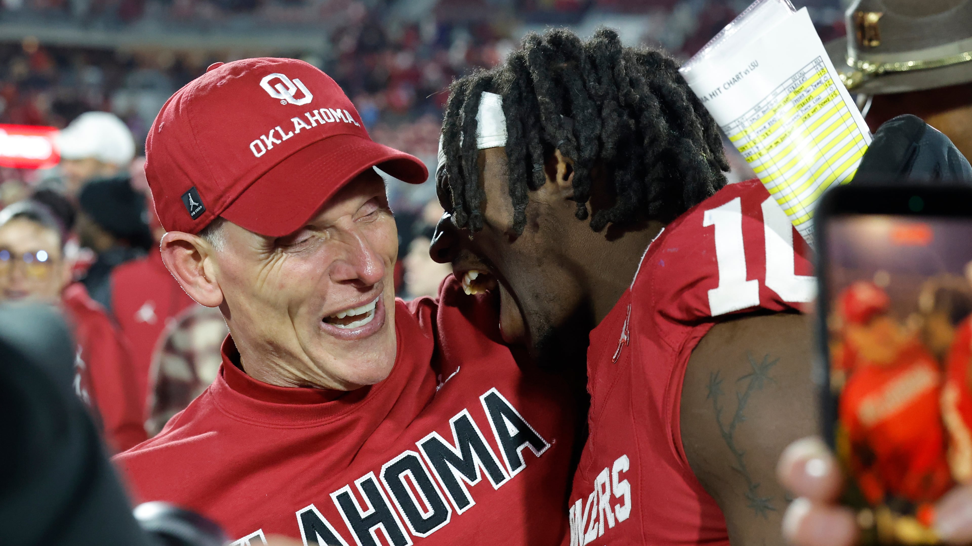 Oklahoma head coach Brent Venables celebrates with linebacker Kip Lewis (10) after defeating LSU during an NCAA college football game Saturday, Nov. 29, 2025, in Norman, Okla. (AP Photo/Alonzo Adams)