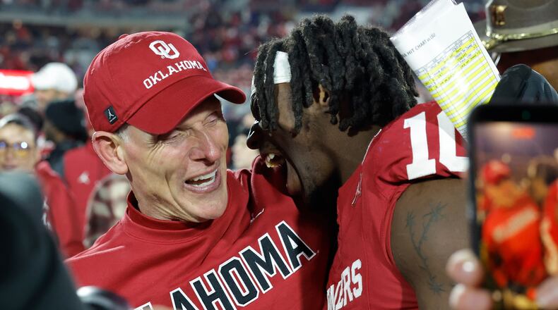 Oklahoma head coach Brent Venables celebrates with linebacker Kip Lewis (10) after defeating LSU during an NCAA college football game Saturday, Nov. 29, 2025, in Norman, Okla. (AP Photo/Alonzo Adams)
