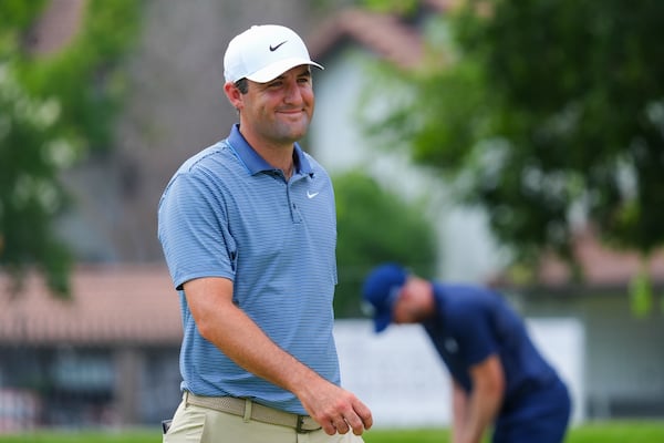 Scottie Scheffler reacts on the 14th hole during the first round of the Charles Schwab Challenge golf tournament at Colonial Country Club in Fort Worth, Texas, Thursday, May 22, 2025. (AP Photo/LM Otero)