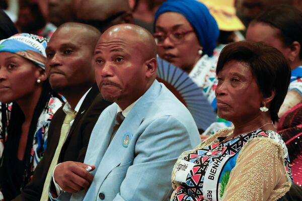 From right, Gertrude Kamara Ntawiha, mother of Floribert Bwana Chui Bin Kositi, a Congolese man killed in 2007 for fighting corruption, and his brothers Jean-Claude, center, and Tresor, attend a ceremony for his beatification in St. Paul Outside the Walls' Basilica, in Rome, Sunday, June 15, 2025. (AP Photo/Riccardo De Luca)