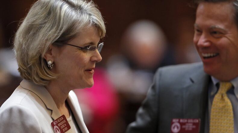 Rep. Beth Beskin, R - Atlanta, gets congratulated by Rep. Rich Golick, R - Smyrna, after the passage of HB 820, related to property assessments for Atlanta residents. Thursday was the 40th and final day of the 2018 General Assembly. BOB ANDRES /BANDRES@AJC.COM