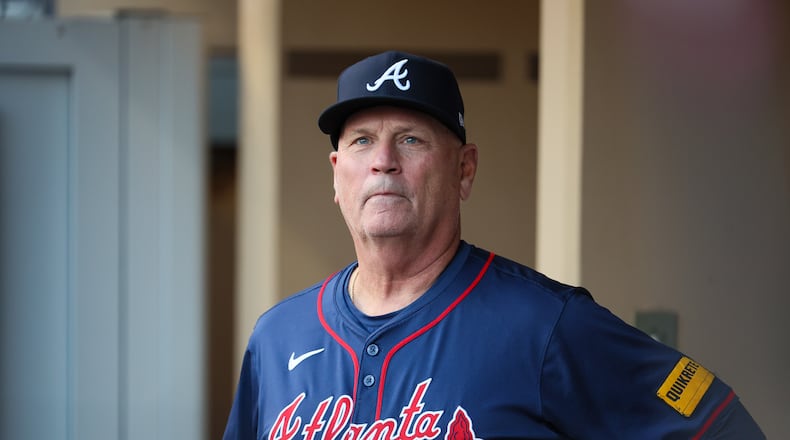Atlanta Braves manager Brian Snitker (43) watches from the dugout before National League Division Series Wild Card Game Two against the San Diego Padres at Petco Park in San Diego on Wednesday, Oct. 2, 2024.   (Jason Getz / Jason.Getz@ajc.com)