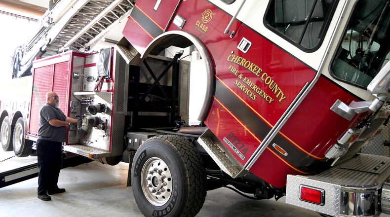 The new Cherokee County fleet building allows fire apparatuses to be lifted completely for maintenance, giving Fire Truck Technician Larry Griffin the ability to do his job more efficiently. CONTRIBUTED