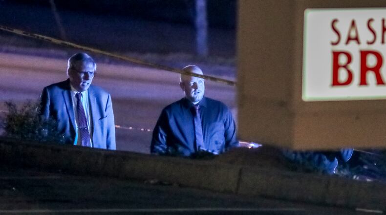 The victim, later identified as Santell Wood, was found shot and lying on a sidewalk the morning of March 2 in front of a strip mall in central DeKalb County.