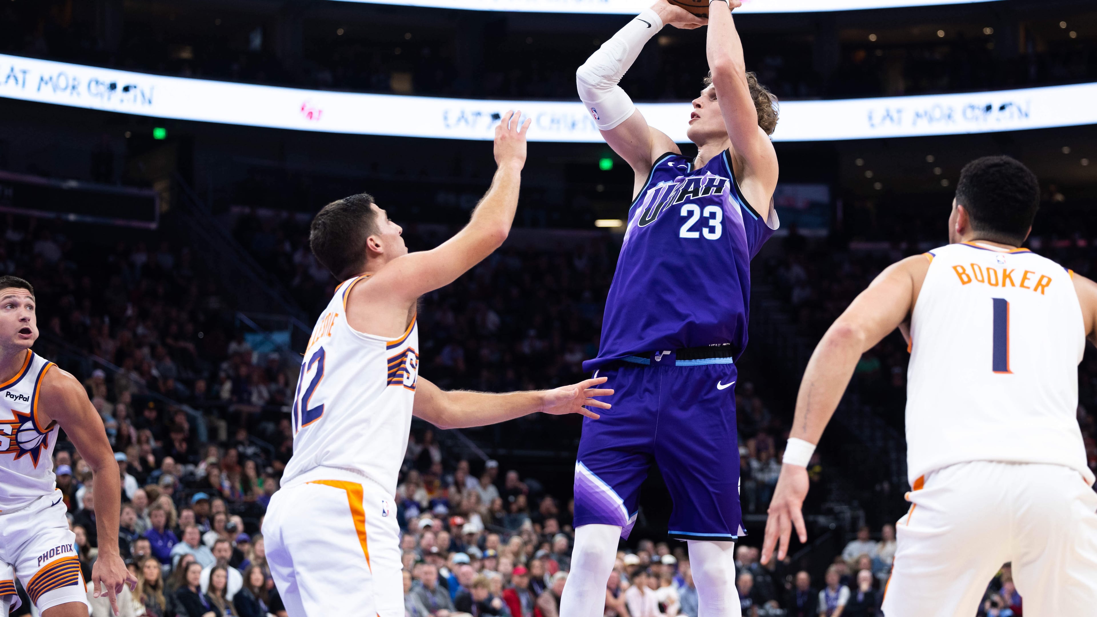 Utah Jazz forward Lauri Markkanen (23) shoots over Phoenix Suns guard Collin Gillespie (12) during the second half of an NBA basketball game, Monday, Oct. 27, 2025, in Salt Lake City. (AP Photo/Anna Fuder)