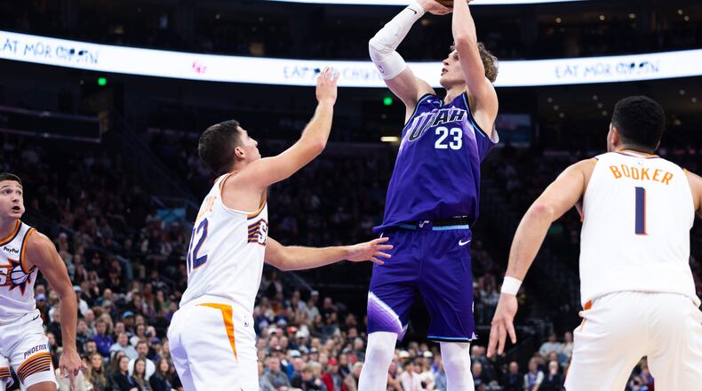 Utah Jazz forward Lauri Markkanen (23) shoots over Phoenix Suns guard Collin Gillespie (12) during the second half of an NBA basketball game, Monday, Oct. 27, 2025, in Salt Lake City. (AP Photo/Anna Fuder)