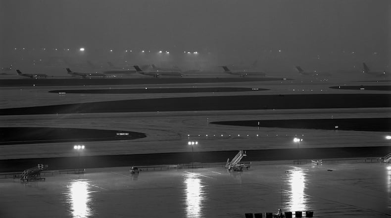 Photographer Mark Steinmetz’s “Untitled” gelatin silver print of planes on the runway at Hartsfield-Jackson International Airport. CONTRIBUTED BY THE ARTIST AND JACKSON FINE ART