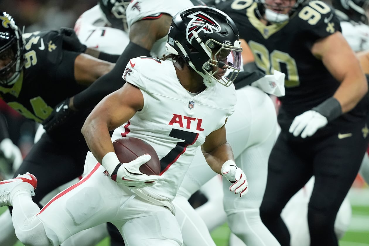 Atlanta Falcons running back Bijan Robinson (7) runs against the New Orleans Saints in the first half of an NFL football game, Sunday, Nov. 23, 2025, in New Orleans. (AP Photo/Gerald Herbert)