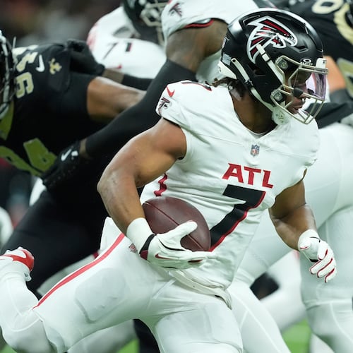 Atlanta Falcons running back Bijan Robinson (7) runs against the New Orleans Saints in the first half of an NFL football game, Sunday, Nov. 23, 2025, in New Orleans. (AP Photo/Gerald Herbert)