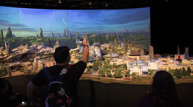 Fans get a preview of Stars Wars: Galaxy's Edge, a new area under construction at Disneyland. the model was shown at the D23 Expo in July. (Gina Ferazzi/Los Angeles Times/TNS)