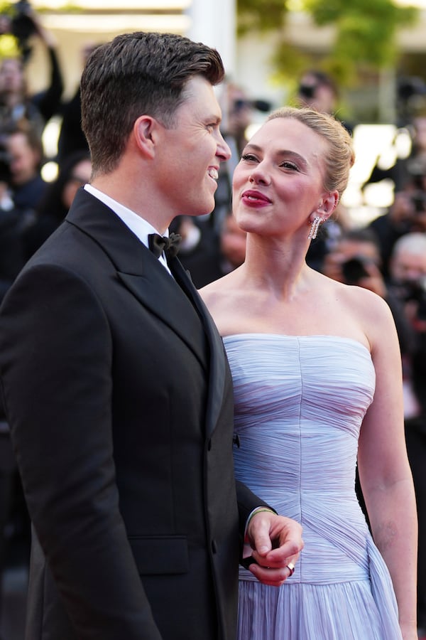 Colin Jost, left, and Scarlett Johansson pose for photographers upon arrival at the premiere of the film 'A Private Life' at the 78th international film festival, Cannes, southern France, Tuesday, May 20, 2025. (Photo by Scott A Garfitt/Invision/AP)