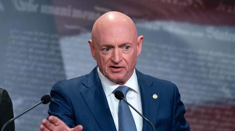 Sen. Mark Kelly, D-Ariz., speaks during a news conference at Capitol Hill, Wednesday, Feb. 11, 2026, in Washington. (AP Photo/Jose Luis Magana)