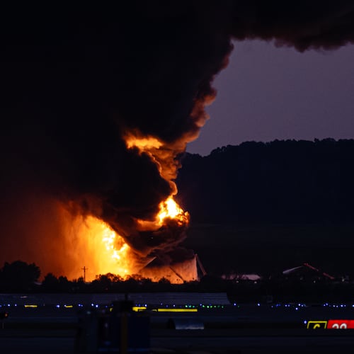A fireball erupts near airport property after reports of a UPS plane crash at Louisville International Airport, Tuesday, Nov. 4, 2025, in Louisville, Ky. (AP Photo/Jon Cherry)
