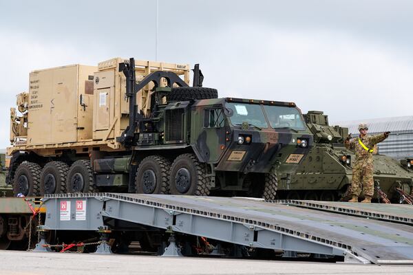 U.S. Army personnel offload tanks and other military vehicles, Monday, June 9, 2025, at the CSX railroad yard in Jessup, Md., ahead of an upcoming military parade commemorating the U.S. Army’s 250th anniversary and coinciding with Donald Trump’s 79th birthday. (AP Photo/Stephanie Scarbrough)
