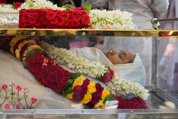 The body of 14-year-old Divyanshi Shivakumar, who lost her life in Wednesday's deadly stampede during celebrations outside a stadium for Royal Challengers Bengaluru, winners of the Indian Premier League, is placed at her residence ahead of her last rites in Bengaluru, India, Thursday, June 5, 2025. (AP Photo/Aijaz Rahi)