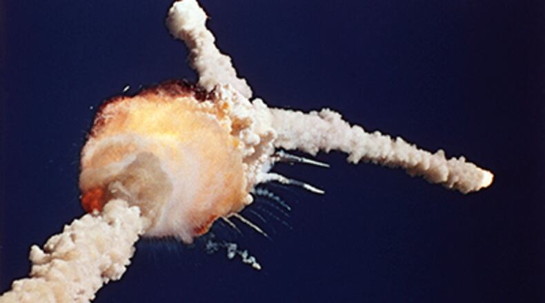 EXPLOSION: In this Jan. 28, 1986 file photo, the space shuttle Challenger explodes shortly after lifting off from the Kennedy Space Center in Cape Canaveral, Fla. (AP Photo/Bruce Weaver, File) ASTRONAUT CREW: This 1986 file photo provided by NASA shows the crew of the space shuttle Challenger, from left, Ellison Onizuka, Mike Smith, Christa McAuliffe, Dick Scobee, Greg Jarvis, Ron McNair and Judith Resnik. (AP Photo/NASA) Lest we forget. The image posted by American Apparel was similar to this one, but had a red background. (File photo)