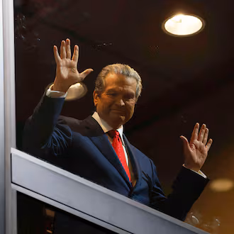 Healthcare business owner Rick Jackson waves to supporters as he comes down in an elevator for his campaign kickoff speech for Georgia governor at Jackson Healthcare, in Alpharetta, Ga., Wednesday, Feb. 4, 2026. (Miguel Martinez/Atlanta Journal-Constitution via AP)