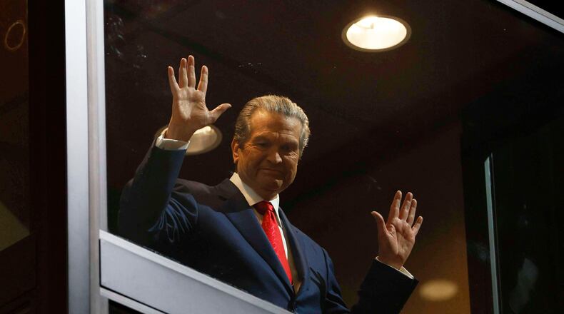 Healthcare business owner Rick Jackson waves to supporters as he comes down in an elevator for his campaign kickoff speech for Georgia governor at Jackson Healthcare, in Alpharetta, Ga., Wednesday, Feb. 4, 2026. (Miguel Martinez/Atlanta Journal-Constitution via AP)