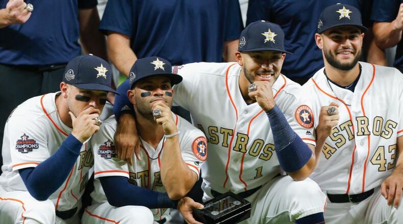 From left, Alex Bregman, Jose Altuve, Carlos Correa and Lance McCullers Jr. show off their World Series rings.