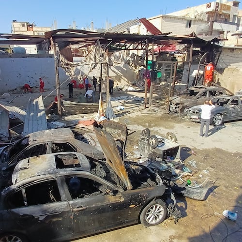 Palestinian rescue workers check the scene where an Israeli strike on Tuesday night hit the Ein el-Hilweh Palestinian refugee camp, in the southern port city of Sidon, Lebanon, Wednesday, Nov. 19, 2025. (AP Photo/Mohammed Zaatari)