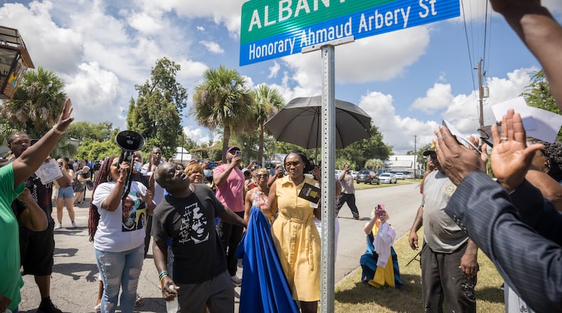 BRUNSWICK, GA - AUGUST, 9, 2022: Ahmaud Arbery's father, Marcus Arbery, and his mother Wanda Cooper-Jones, look on as city officials unveil a street sign commemorating their slain son. (AJC Photo/Stephen B. Morton)