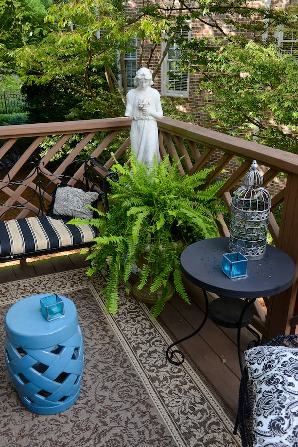 A back deck allows homeowners Jeffrey Chandler and Pedro Ayestaran Diaz plenty of space to get outside and enjoy the mature trees and azaleas in their townhome community. Text by Lori Johnston and Keith Still/Fast Copy News Service. (Christopher Oquendo Photography/www.ophotography.com)