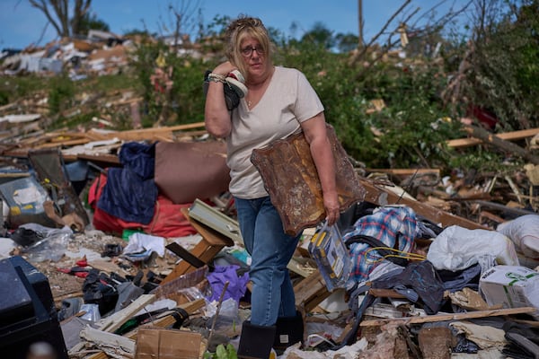 Edwina Wilson stands in what is left of her destroyed home, Sunday, May 18, 2025, in London, Ky., after a severe storm passed through the area. (AP Photo/Carolyn Kaster)