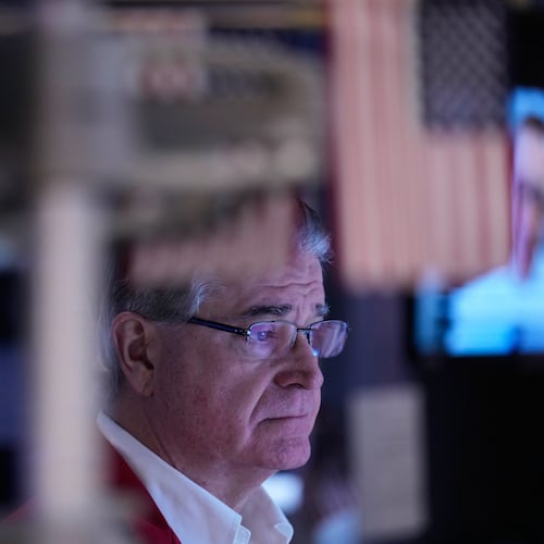 Daniel Kryger works on the floor at the New York Stock Exchange in New York, Friday, Jan. 9, 2026. (AP Photo/Seth Wenig)