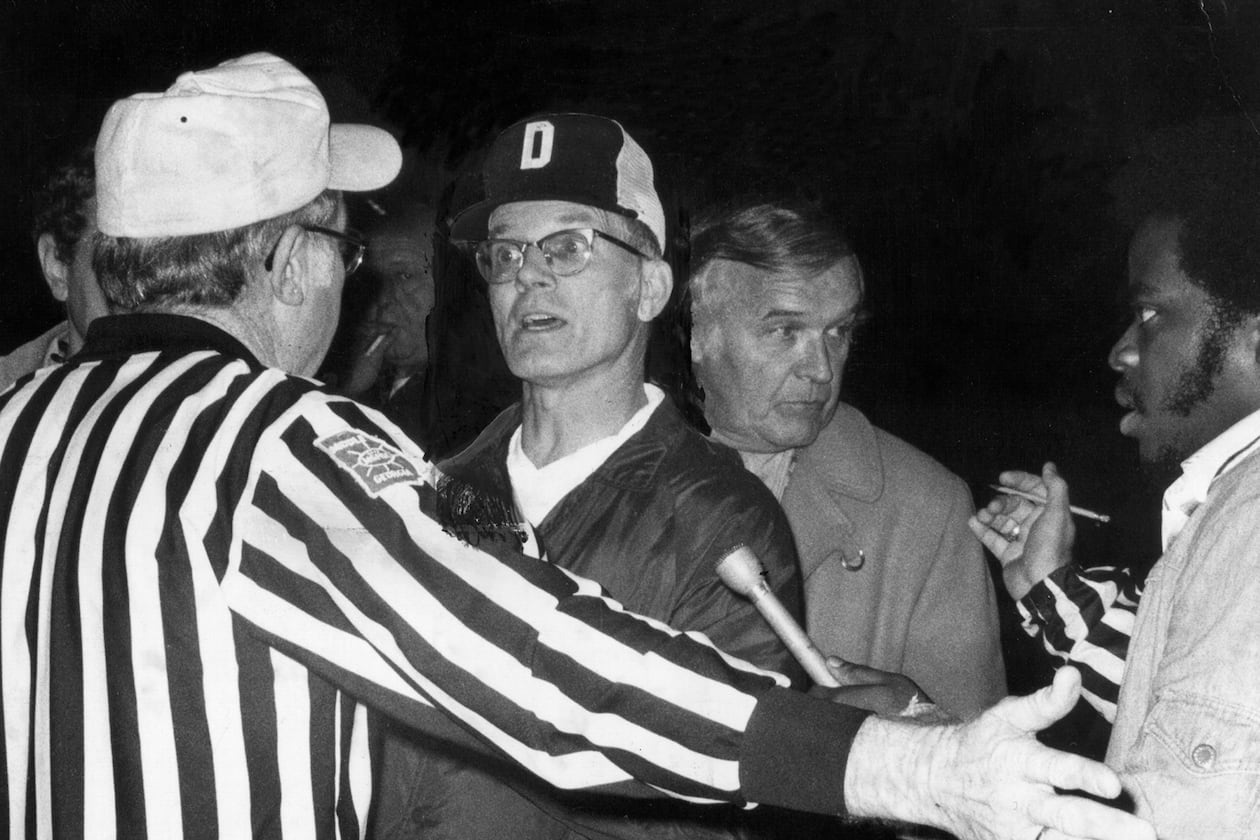 Douglass football coach Charlie Brannon argues with officials in 1975. (AJC file)