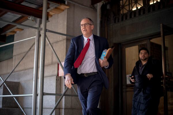 
                        Chris Conroy, a prosecutors with the Manhattan district attorney's office, leaves Manhattan Criminal Court in Manhattan, March 30, 2023. A Manhattan grand jury voted to indict Donald J. Trump on Thursday for his role in paying hush money to a porn star, according to four people with knowledge of the matter. (Hilary Swift/The New York Times)
                      