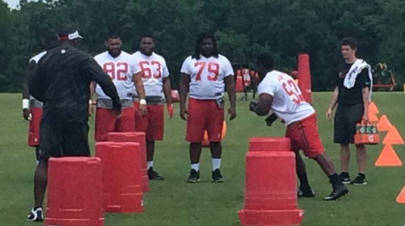 Falcons defensive tackle Grady Jarrett going through the paces under the watchful eye of Bryan Cox. (D. Orlando Ledbetter/DLedbetter@ajc.com)