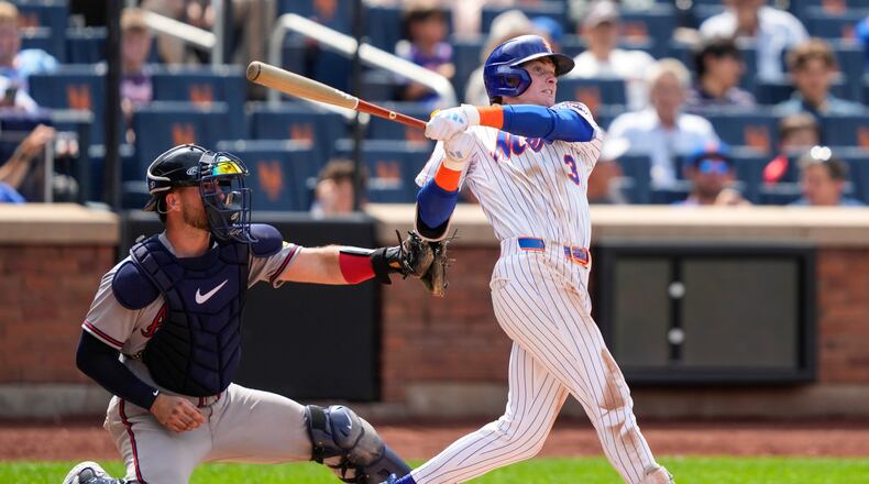 New York Mets' Carson Benge hits an RBI double during the seventh inning in the first baseball game of a doubleheader against the Atlanta Braves, Wednesday, July 29, 2026, in New York. (AP Photo/Yuki Iwamura)